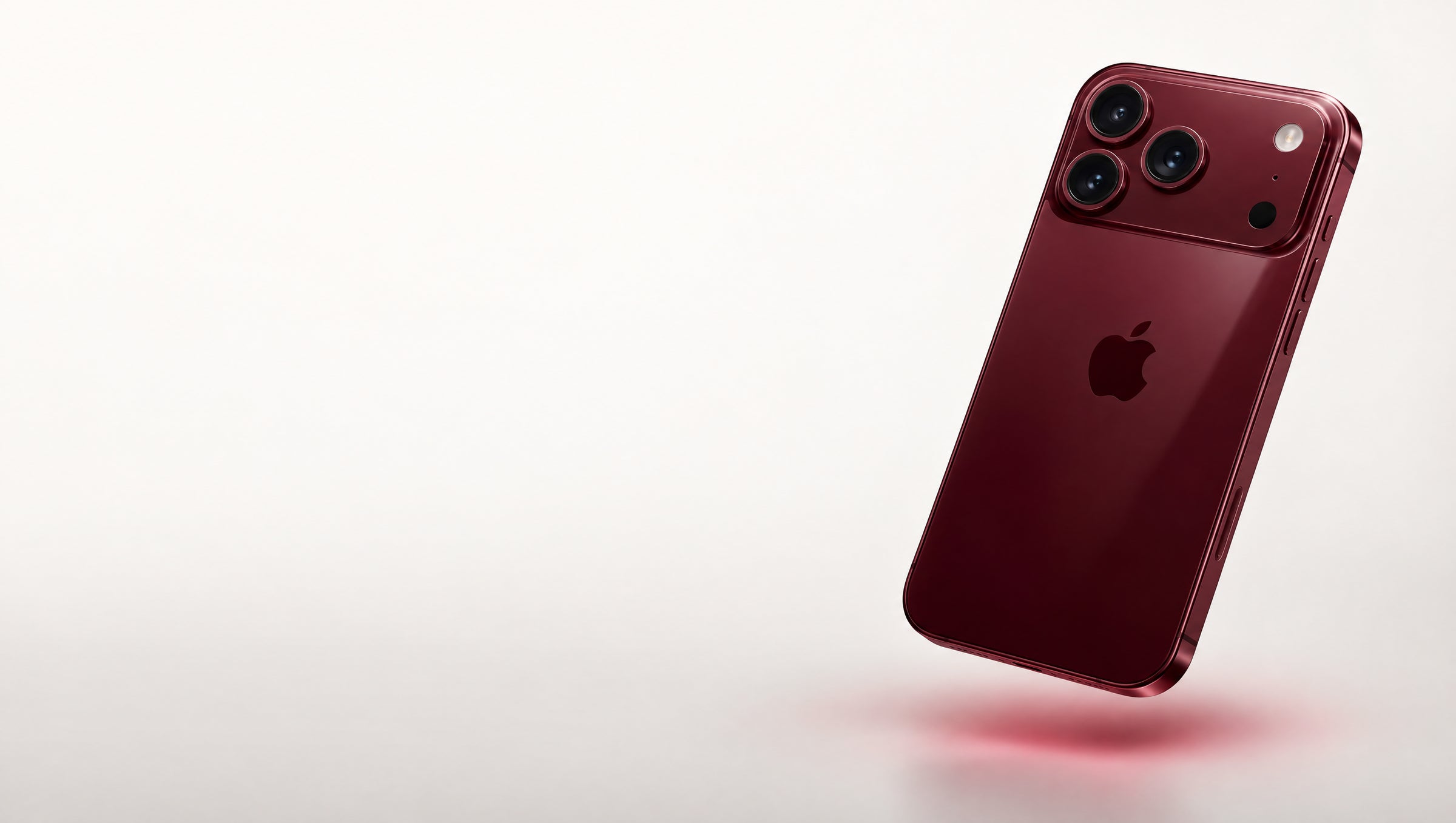 iPhone 18 Pro Max in burgundy floating above a light studio backdrop